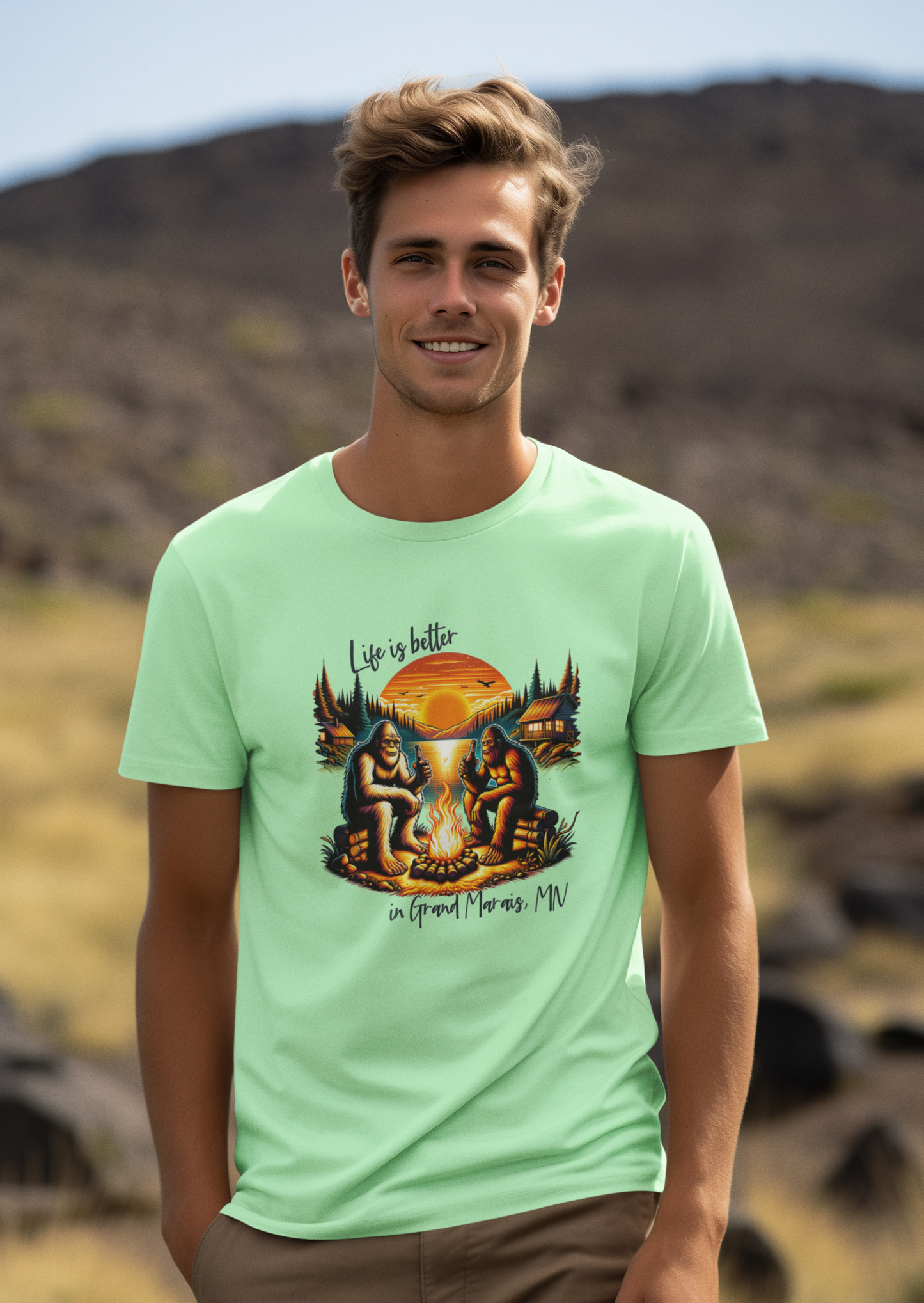 Life is better in...YOUR LOCATION - Bigfoot campfire shirt: Carolina blue / LG